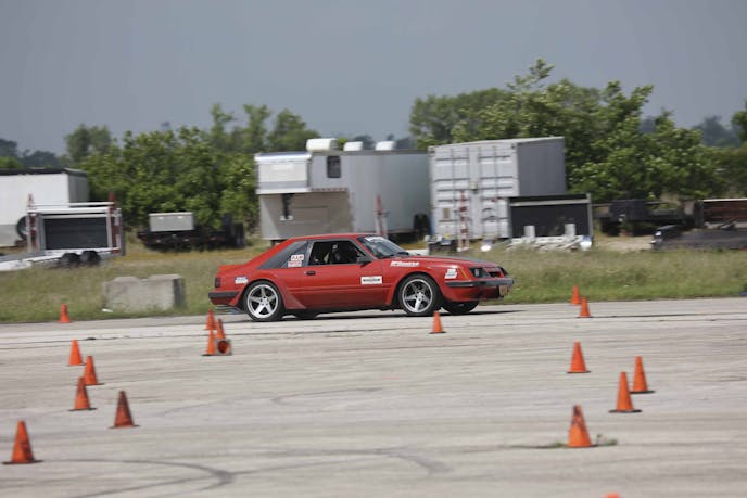 Red Mustang on autocross track