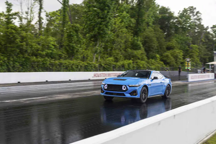Blue mustang on drag strip