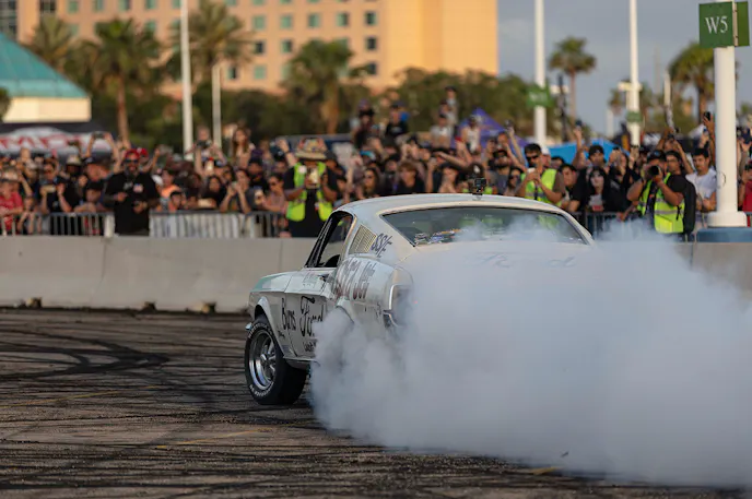 First generation mustang doing a burnout.