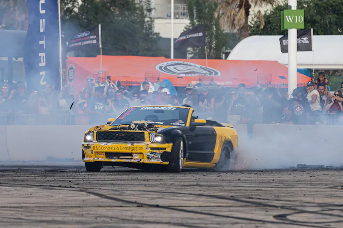 Yellow Mustang doing a burnout