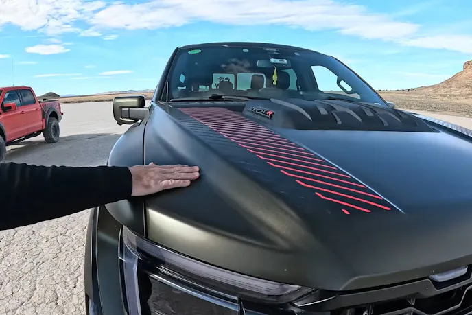 ford raptor with a green wrap