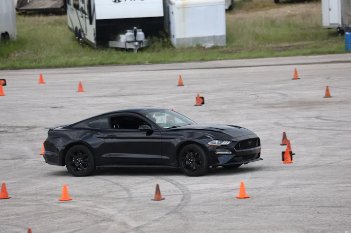 Black S550 Mustang running an autocross course