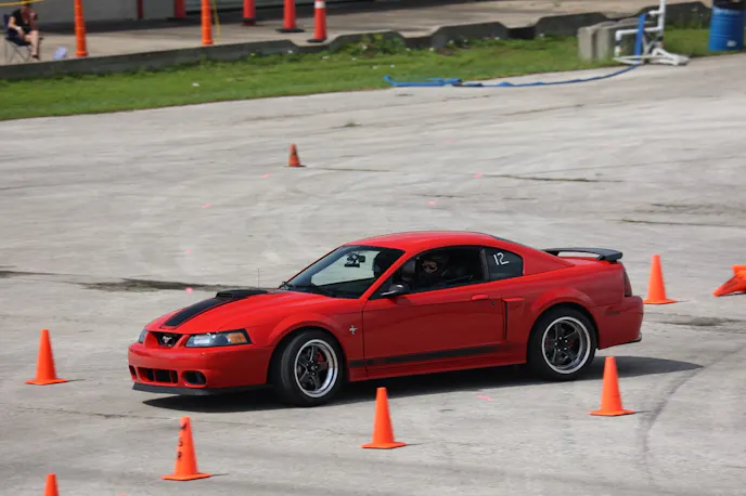Red Newedge Mach 1 Mustang at autocross