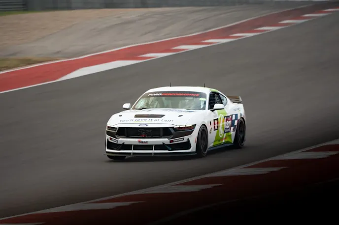White Mustang Dark Horse R on track