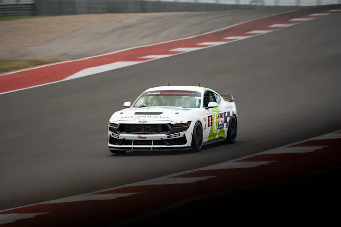 White Mustang Dark Horse R on track