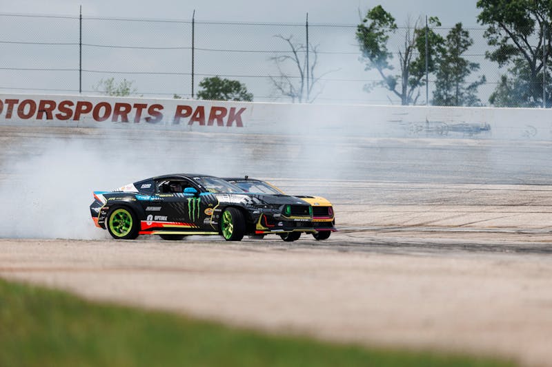 Two RTR Mustangs drifting at Houston Motorsports Park