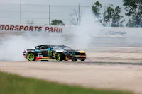 Two RTR Mustangs drifting at Houston Motorsports Park