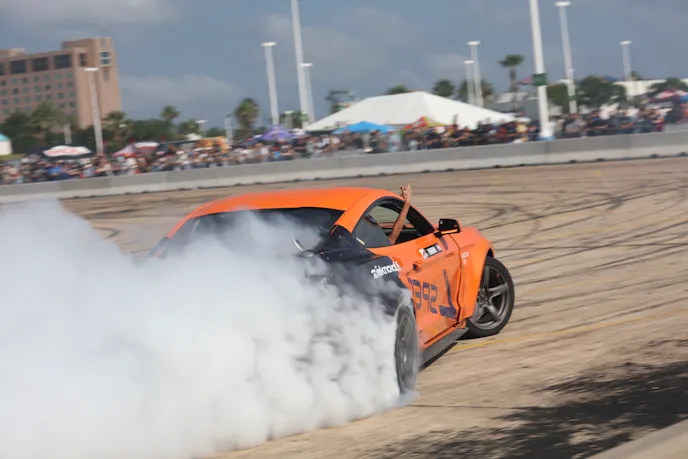 Orange S550 Mustang drifting