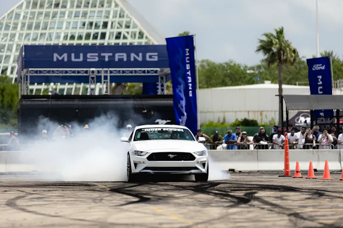 White S550 Mustang doing a burnout